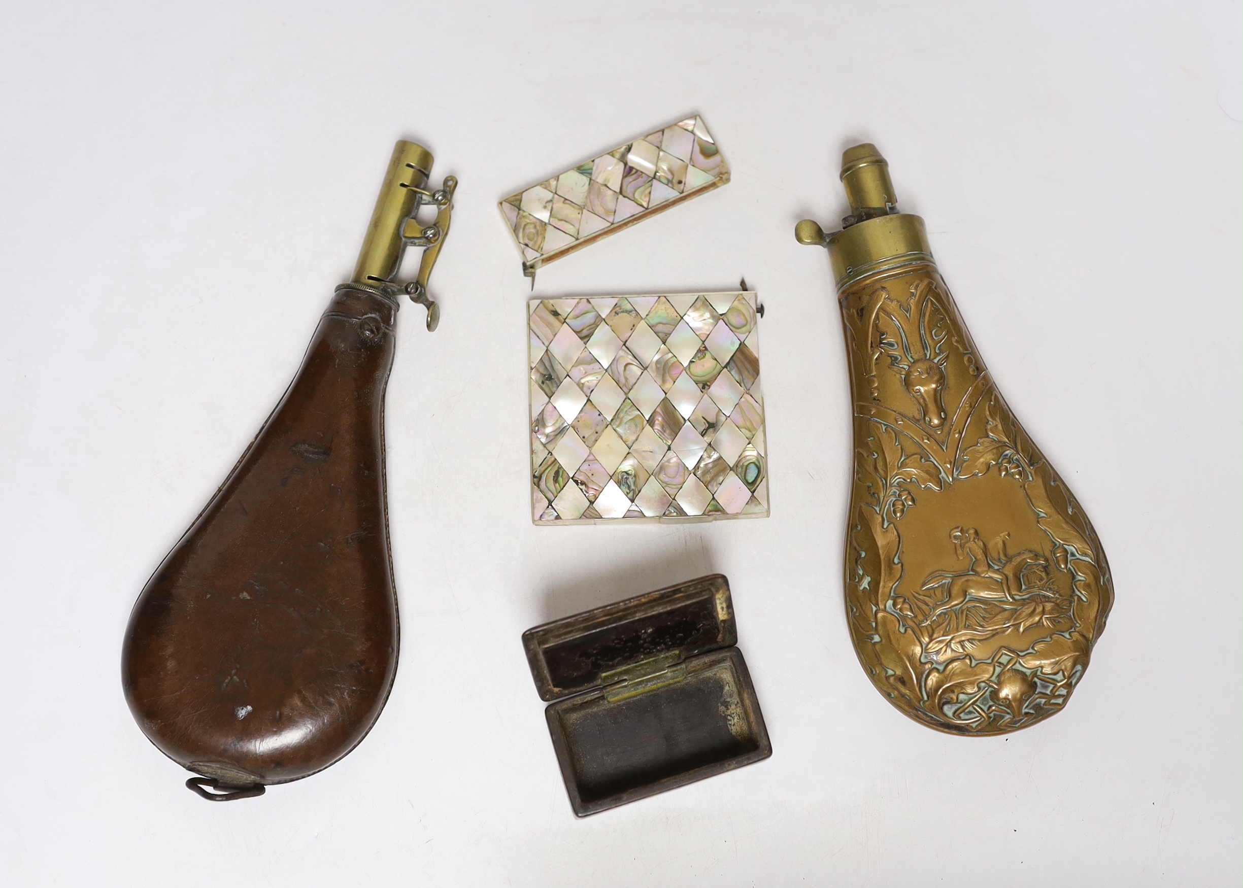 A Victorian embossed brass powder flask, a leather shot flask and a Victorian mother of pearl and abalone calling card case